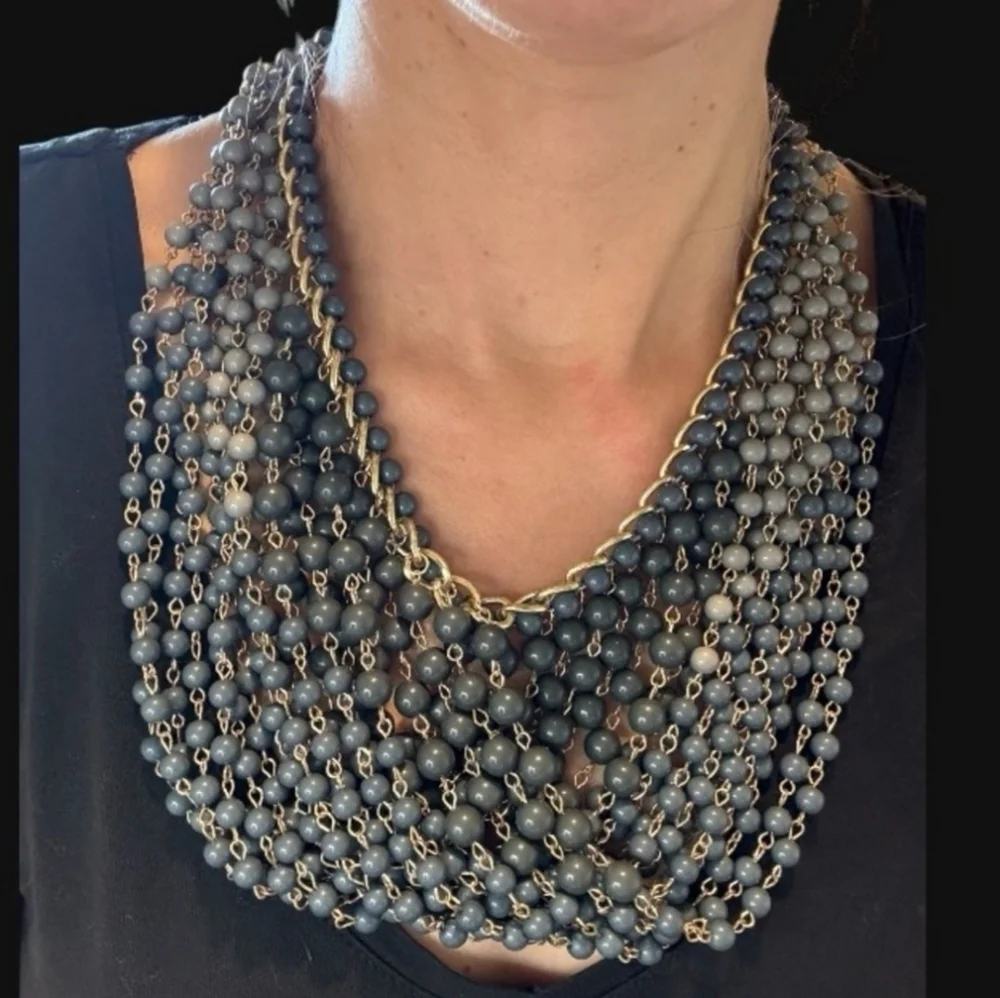 Gold plated cuban link chain with dangling graduated color jasper roundbeads
